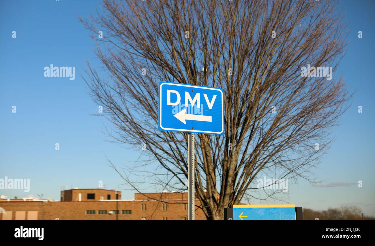 DMV sign street showing where to get drivers registration Stock Photo