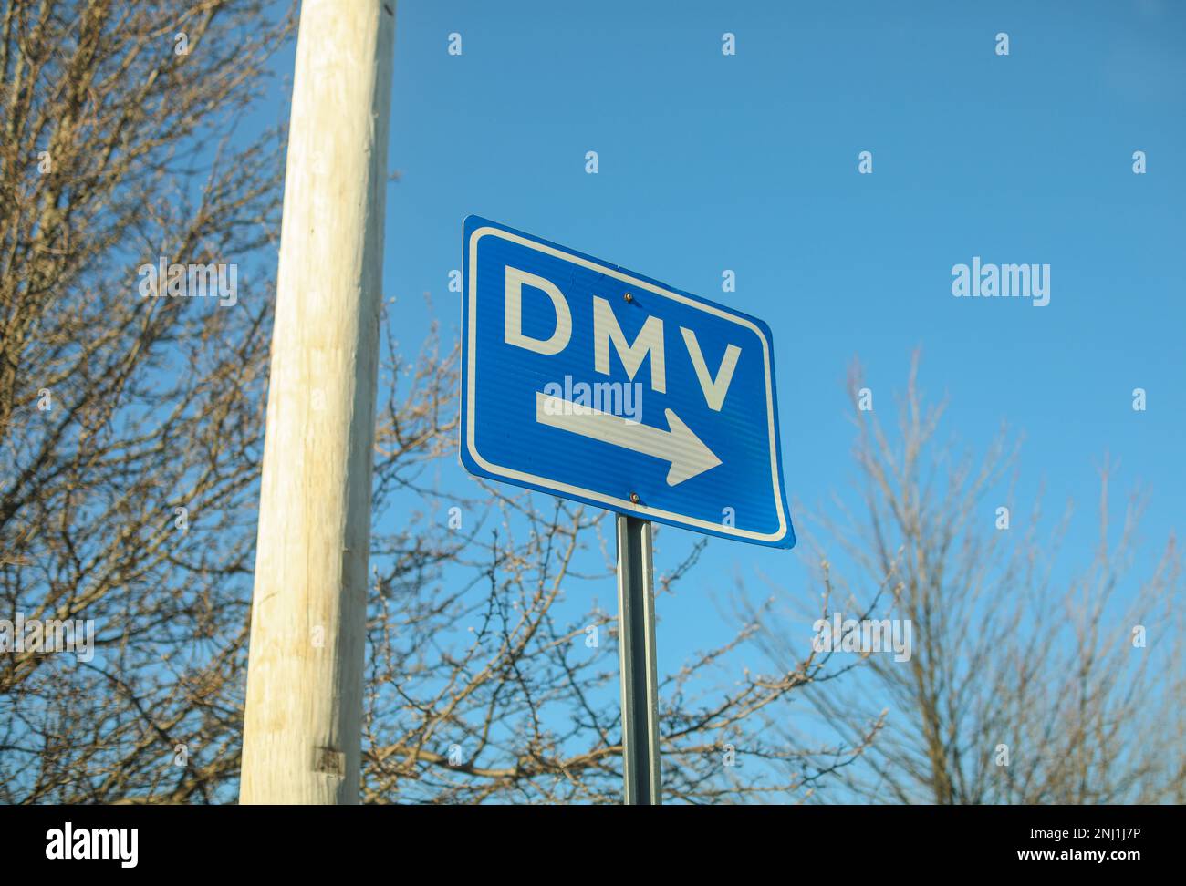 DMV sign street showing where to get drivers registration Stock Photo