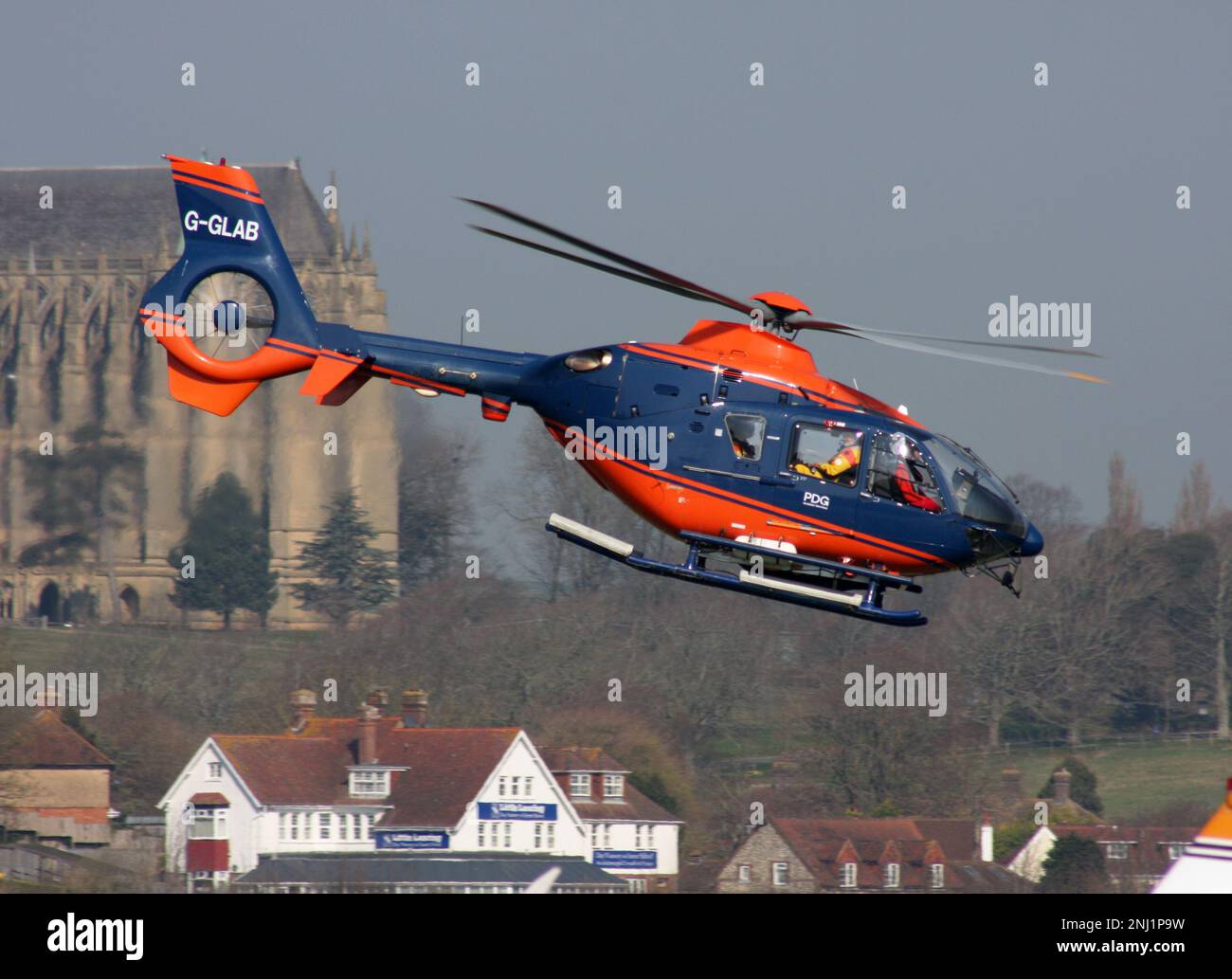 A Eurocopter EC 135T2+ helicopter of PDG Helicopters departing Brighton City Airport Sussex England Stock Photo
