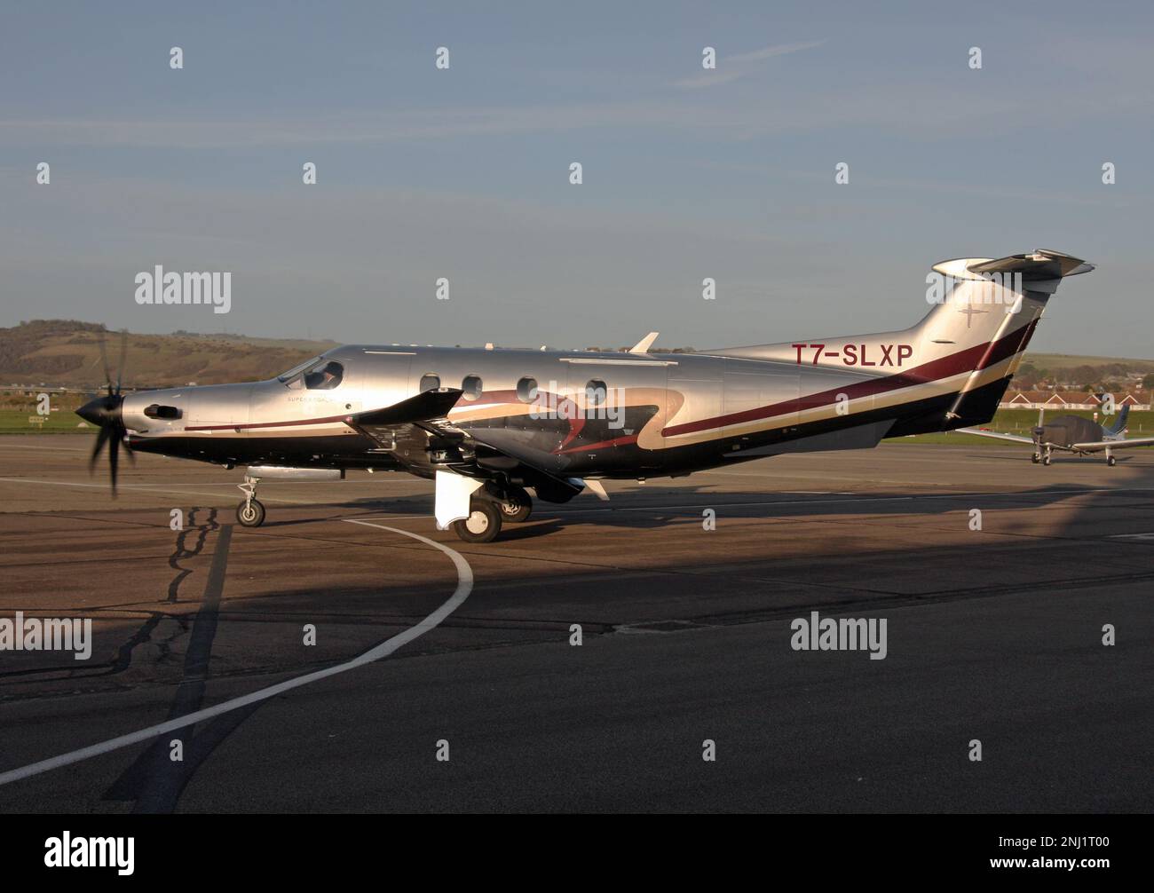 A Pilatus PC-12/47 single engine executive aircraft on the ramp at Brighton City Airport Stock Photo