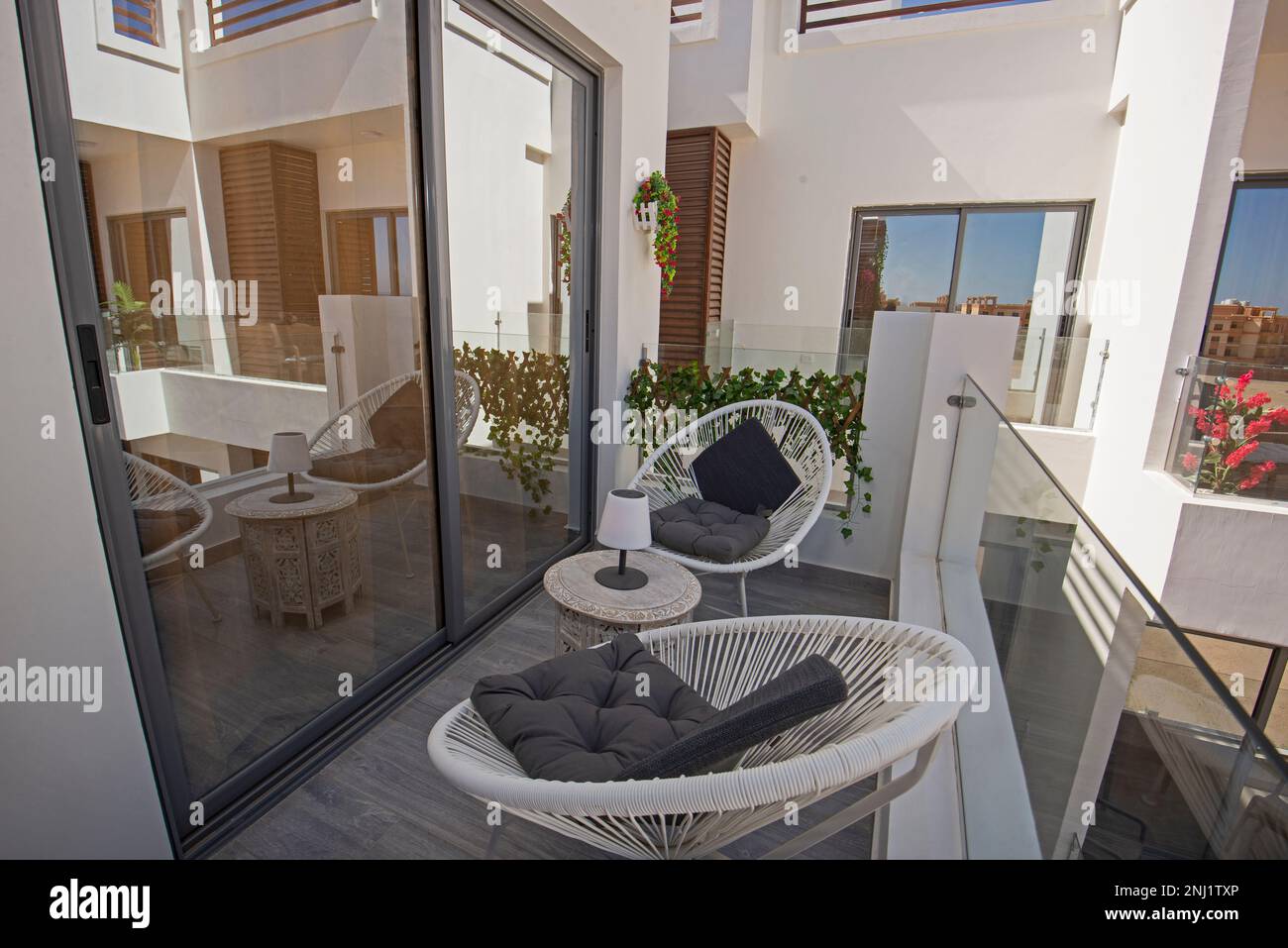 Terrace furniture of a luxury apartment in tropical resort with table ...