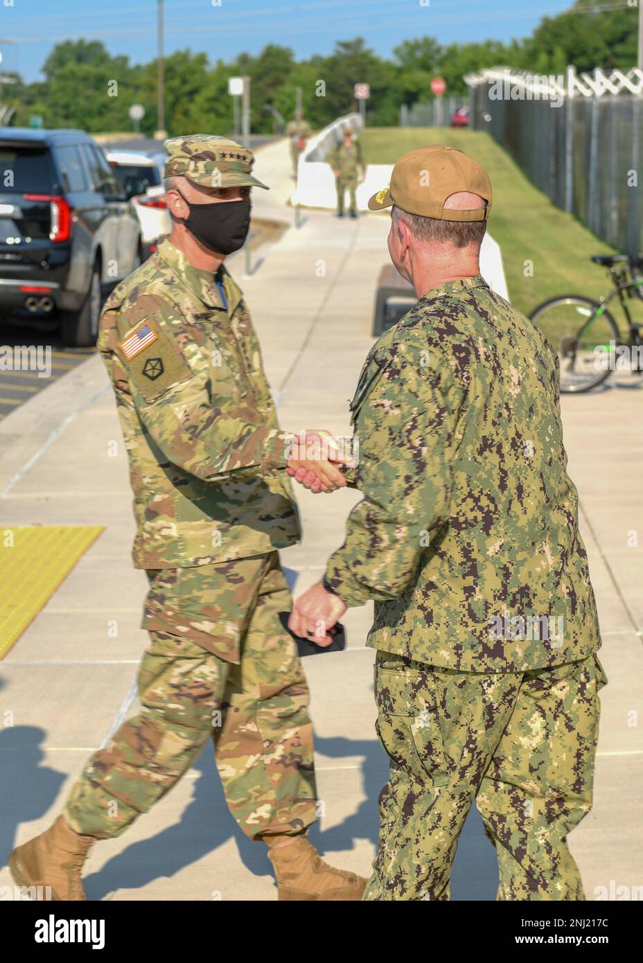 220804-N-XK809-1019 FORT GEORGE G. MEADE, Md. (Aug. 4, 2022) General Paul M. Nakasone, Commander, left, U.S. Cyber Command, Director, National Security Agency and Chief, Central Security Service, is greeted by Vice Adm. Ross Myers, Commander, U.S. Fleet Cyber Command/U.S. 10th Fleet, prior to a change of command ceremony at the U.S. Fleet Cyber Command/U.S. 10th Fleet Headquarters. During the ceremony, Vice Adm. Craig Clapperton relieved Vice Adm. Ross Myers as commander of U.S. Fleet Cyber Command/U.S. 10th Fleet. Stock Photo