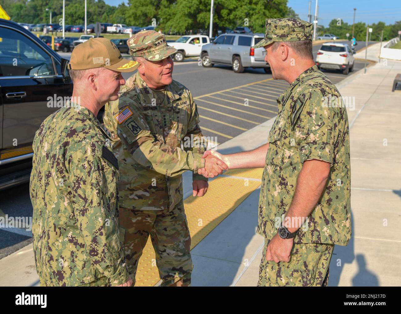 220804-N-XK809-1010 FORT GEORGE G. MEADE, Md. (Aug. 4, 2022) U.S. Army Gen. James H. Dickinson, center, United States Space Command Commander, is greeted by Vice Adm. Ross Myers, left, Commander, U.S. Fleet Cyber Command/U.S. 10th Fleet, and Vice Adm. Craig Clapperton, right, prospective Commander, U.S. Fleet Cyber Command/U.S. 10th Fleet,  prior to a change of command ceremony at the U.S. Fleet Cyber Command/U.S. 10th Fleet Headquarters. During the ceremony, Vice Adm. Craig Clapperton relieved Vice Adm. Ross Myers as commander of U.S. Fleet Cyber Command/U.S. 10th Fleet. Stock Photo