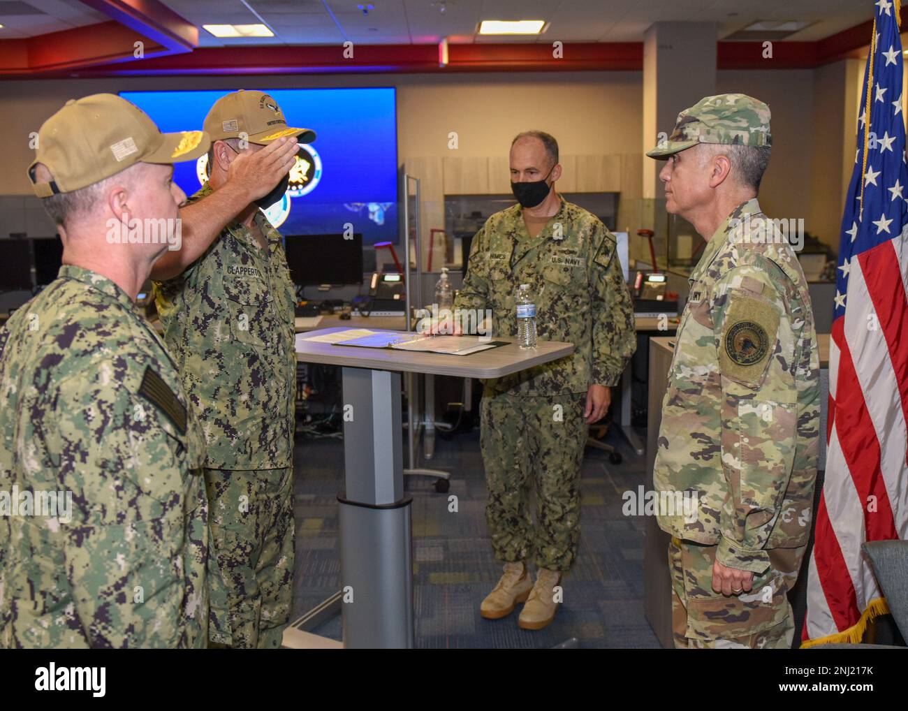 220804-N-XK809-1219 FORT GEORGE G. MEADE, Md. (Aug. 4, 2022) Vice Adm. Craig Clapperton, left, salutes General Paul M. Nakasone, Commander, U.S. Cyber Command, Director, National Security Agency and Chief, Centeral Security Service as he assumes command of U.S. Fleet Cyber Command/U.S. 10th Fleet during a change of command ceremony at the U.S. Fleet Cyber Command/U.S. 10th Fleet Headquarters. During the ceremony, Vice Adm. Craig Clapperton relieved Vice Adm. Ross Myers as commander of U.S. Fleet Cyber Command/U.S. 10th Fleet. Stock Photo