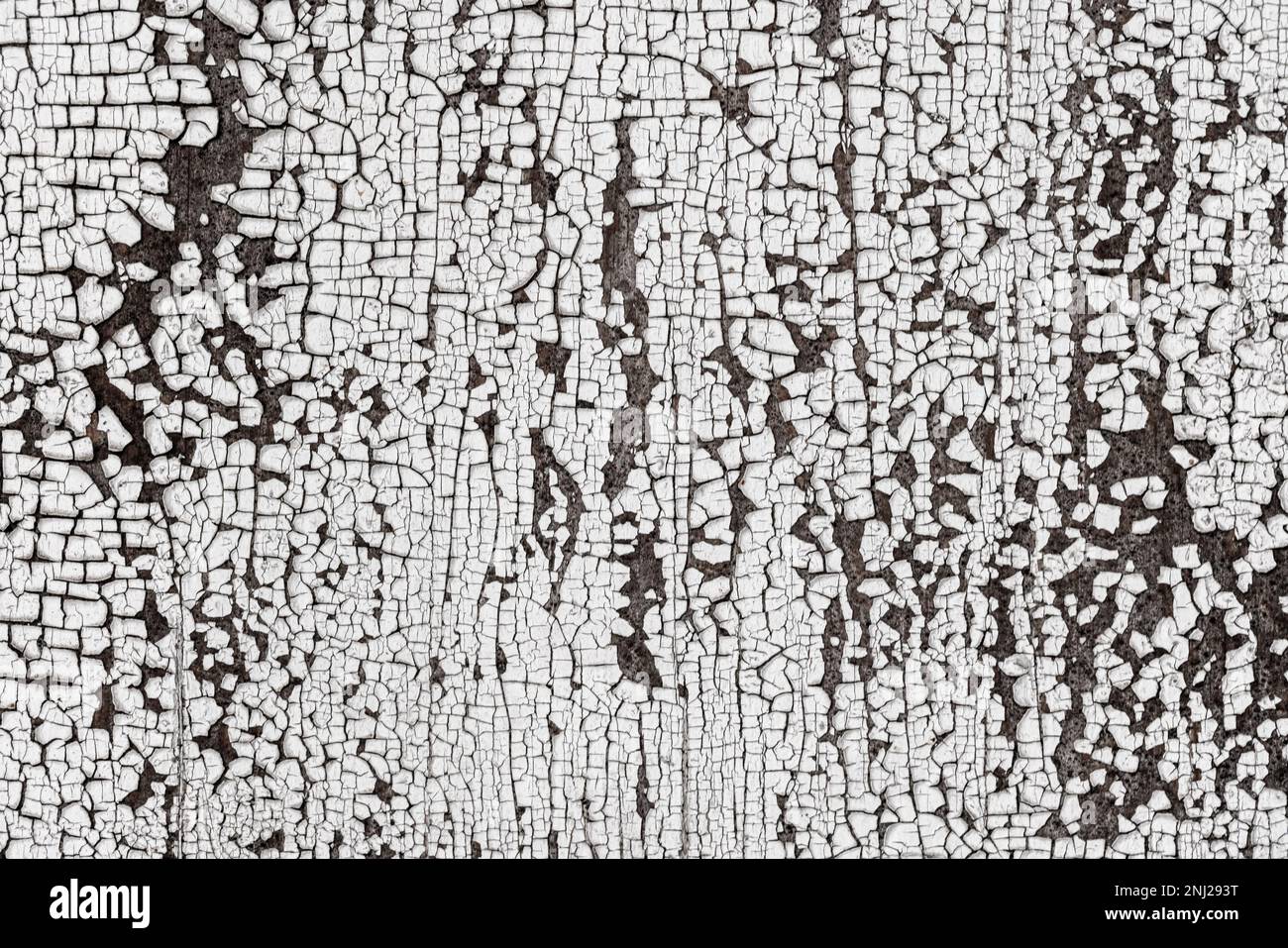 Old wooden wall with cracked peeling white paint. Abstract background ...