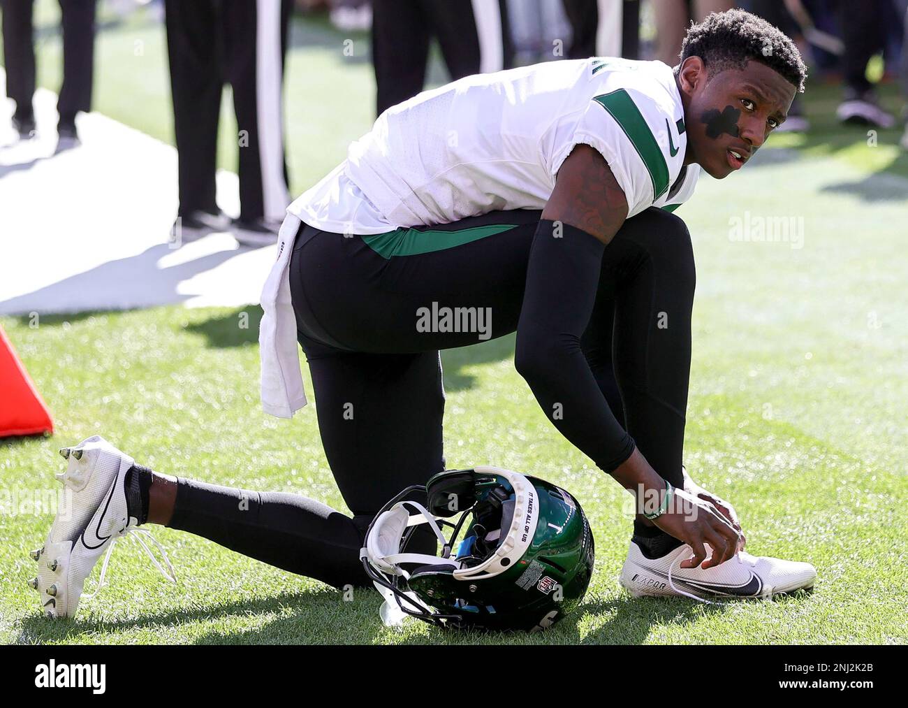 DENVER, CO - OCTOBER 23: New York Jets running back Michael Carter walks on  the sidelines before a NFL game between the New York Jets and the Denver  Broncos on October 23