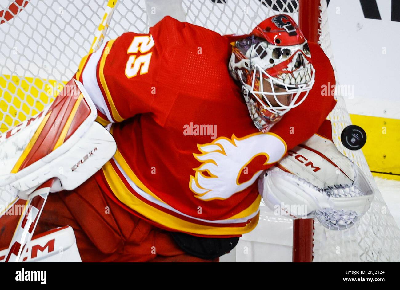 Calgary Flames Goalie Jacob Markstrom Stops The Puck During The First calgary-flames-goalie-jacob-markstrom-stops-the-puck-during-the-first