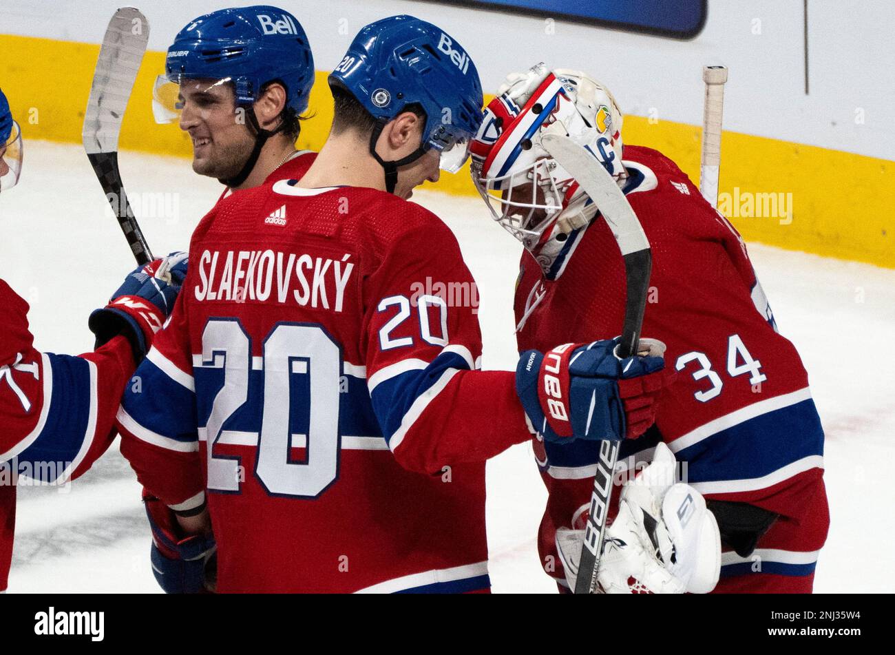 Montreal Canadiens' Juraj Slafkovsky, right, and goaltender Jake Allen ...