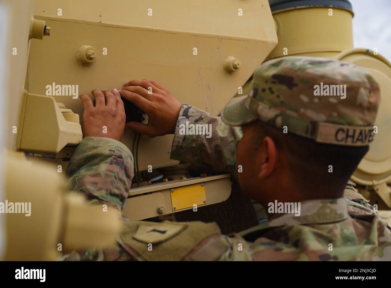 A U.S. Soldier assigned to 541st Division Sustainment Support Battalion, 1st Sustainment Brigade, 1st Infantry Division installs Multiple Integrated Laser Engagement System (MILES) onto a M1083 Medium Tactical Vehicle (MTV) during Decisive Action Rotation 22-09 at the National Training Center, Fort Irwin, Calif., Aug. 4, 2022. Stock Photo