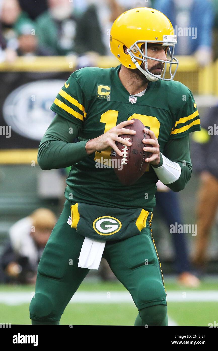 GREEN BAY, WI - OCTOBER 16: Green Bay Packers quarterback Aaron Rodgers  (12) drops to pass during a game between the Green Bay Packers and the New  York Jets at Lambeau Field