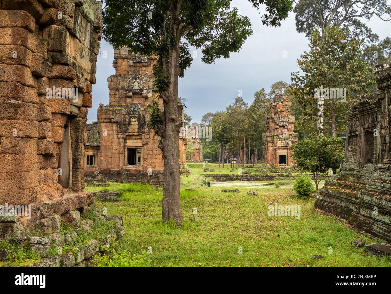 The rear of the 12th century Prasat Suor Prat towers next to a Khleangs, or storeroom, opposite the Elephant Terrace within Angkor Thom in Cambodia. Stock Photo