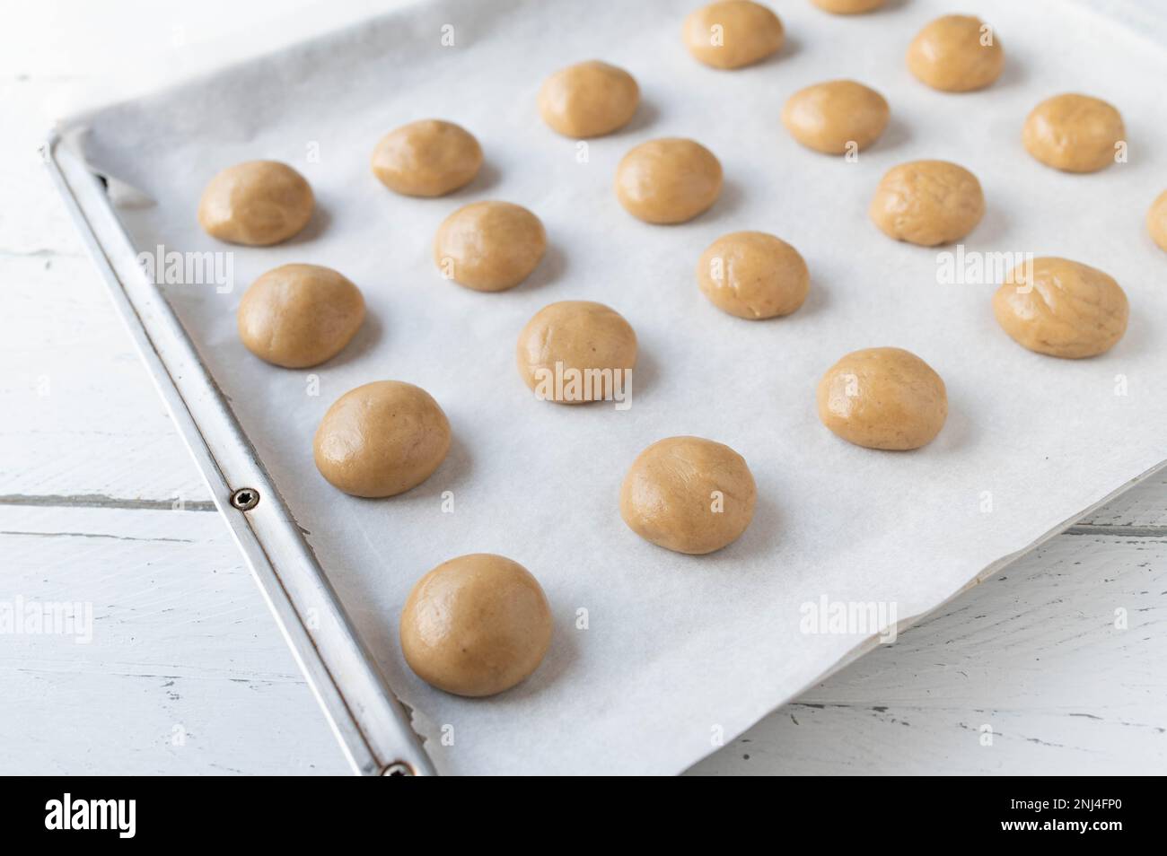 Raw and unbaked gingerbread cookies on a baking sheet Stock Photo