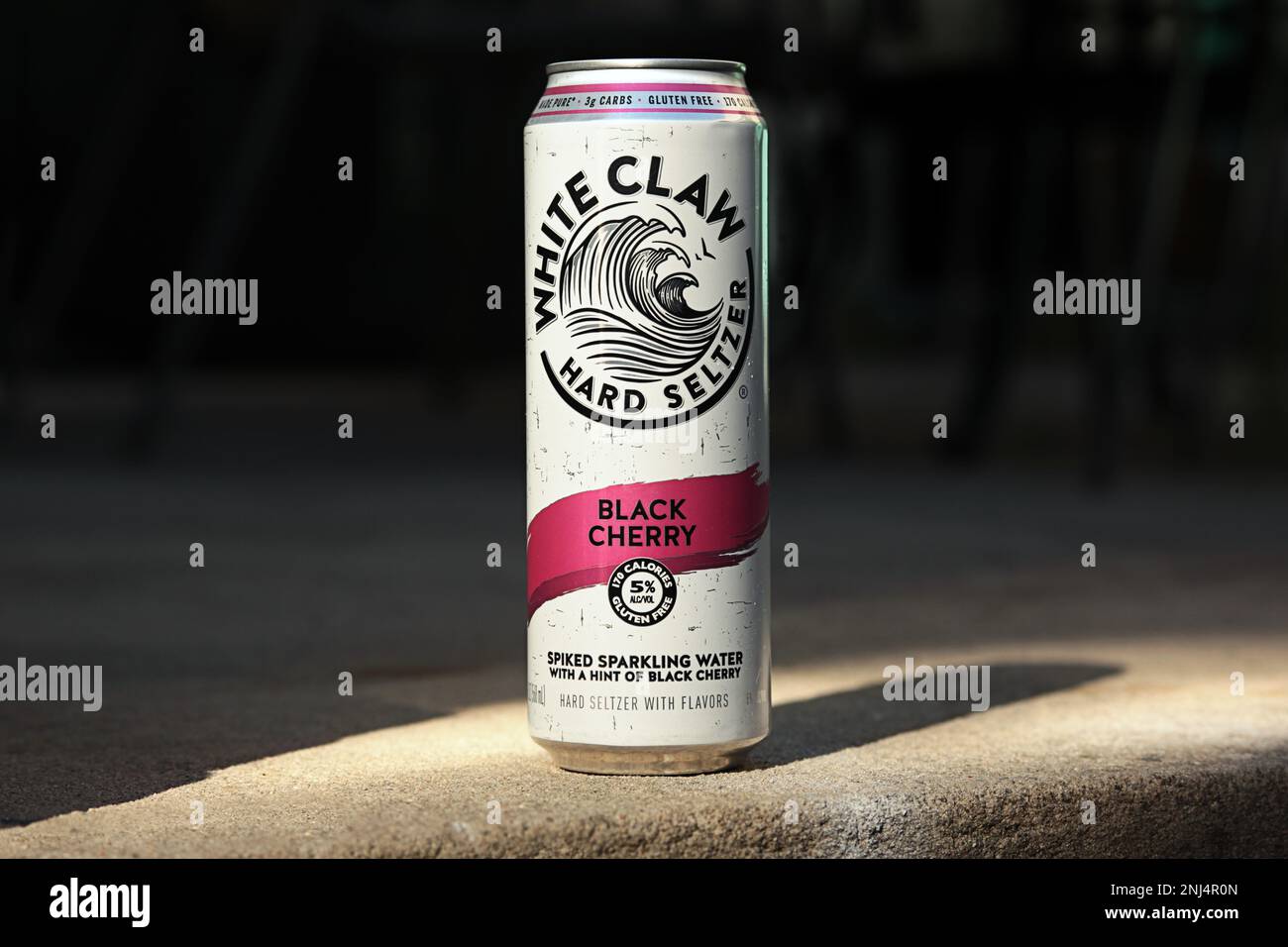 Bronx, NY - June 16, 2021: Close up of Black Cherry flavor White Claw brand hard seltzer can on an urban concrete patio Stock Photo