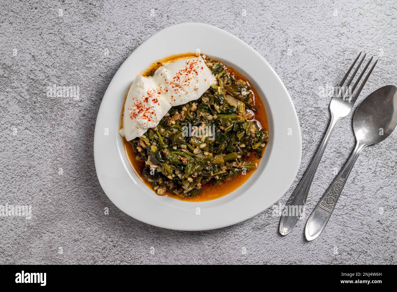 Traditional Turkish spinach meal with rice and minced meat with yogurt
