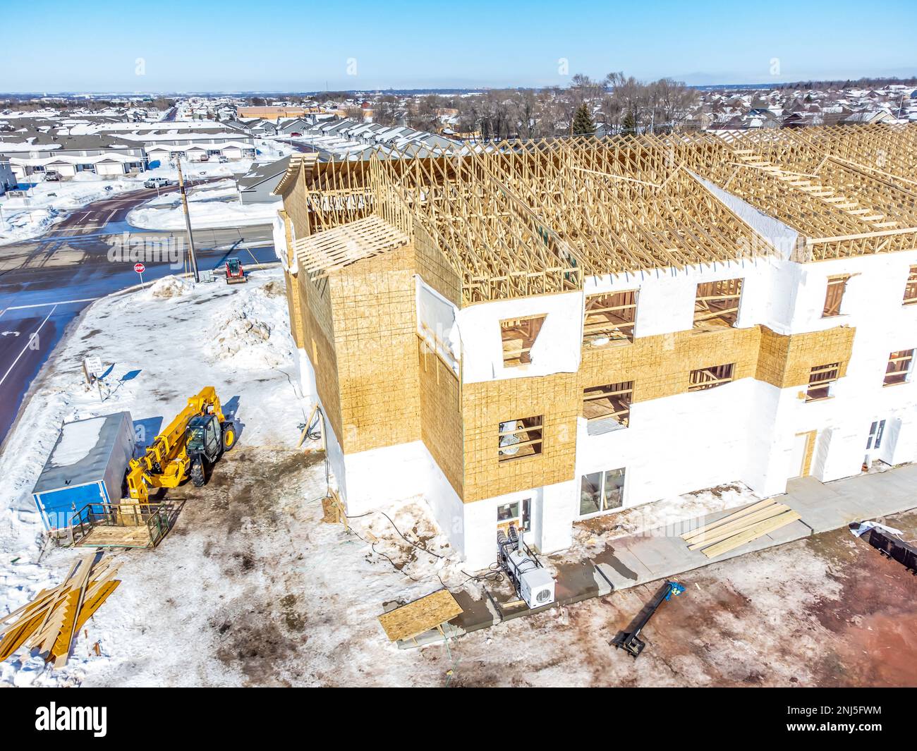 Aerial drone view of a multifamily apartment complex under construction ...