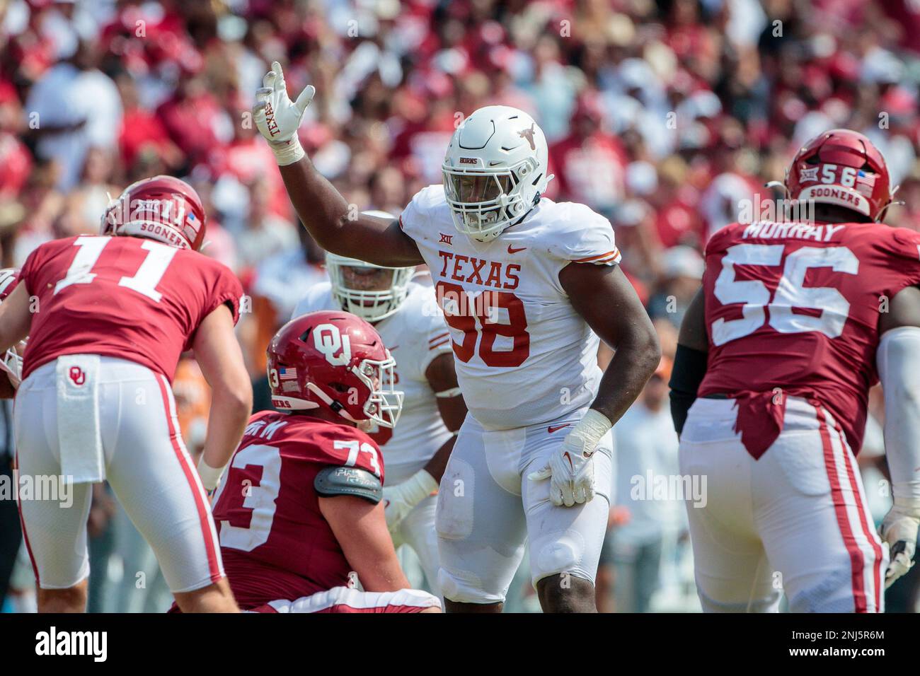 DALLAS, TX - OCTOBER 08: Texas Longhorns defensive end Barryn Sorrell (88)  pumps up the crowd prior to a play during the second half against the  Oklahoma Sooners on October 8th 2022