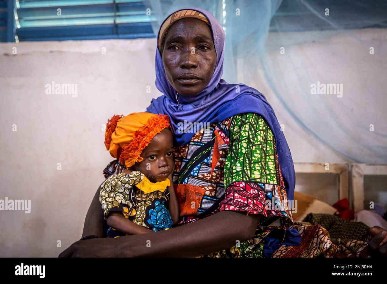 Zouera Saidou is in hospital with her granddaughter, 2-year-old weighing 6.4kg - half the average weight of a child her age, also suffering from malnutrition. Malnutrition is a recurring crisis in Niger, a landlocked West African country, where climate change, conflict and a fast growing population are all increasing the challenges when it comes to getting enough food. In 2022, 4.4 million Nigeriens were said to be in need of urgent humanitarian assistance. (Photo by Sally Hayden / SOPA Images/Sipa USA) Stock Photo