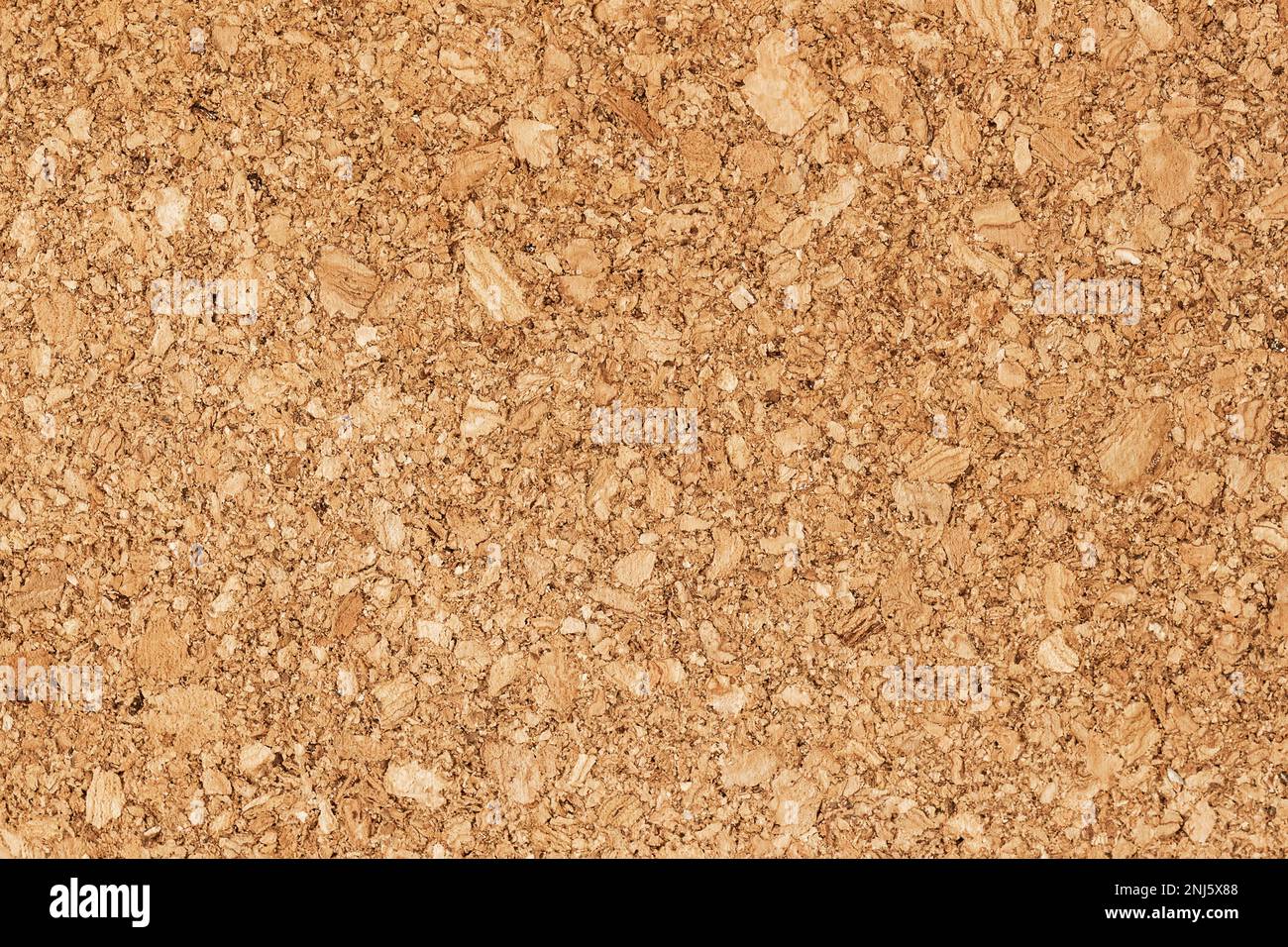 Wooden background, fiberboard texture. Recycled compressed wood