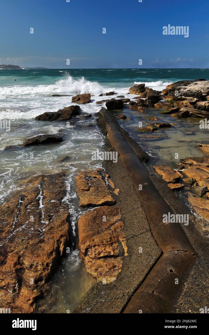 505 Strong waves break on the rocks next to Marine Parade in Manly suburb. Sydney-Australia. Stock Photo
