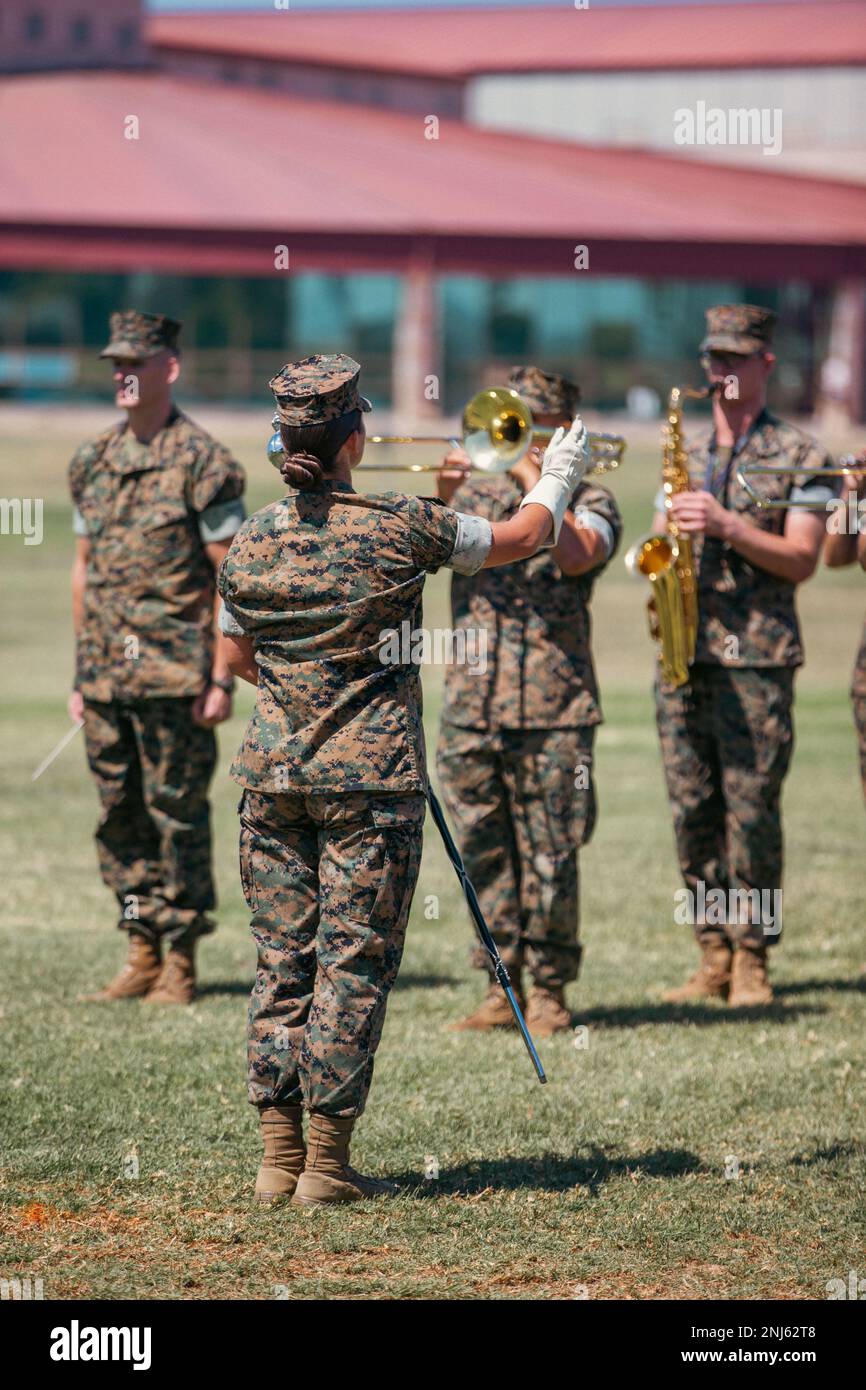 U.S. Marine Corps Staff Sgt. Jessica Larson, a drum major with the 1st Marine Division band, leads the band during a Headquarters and Support Battalion change of command ceremony at Paige Field House on Marine Corps Base Camp Pendleton, California, Aug. 5, 2022. The Marines of H&S Bn. provide administrative and training support for personnel assigned to Camp Pendleton. Stock Photo