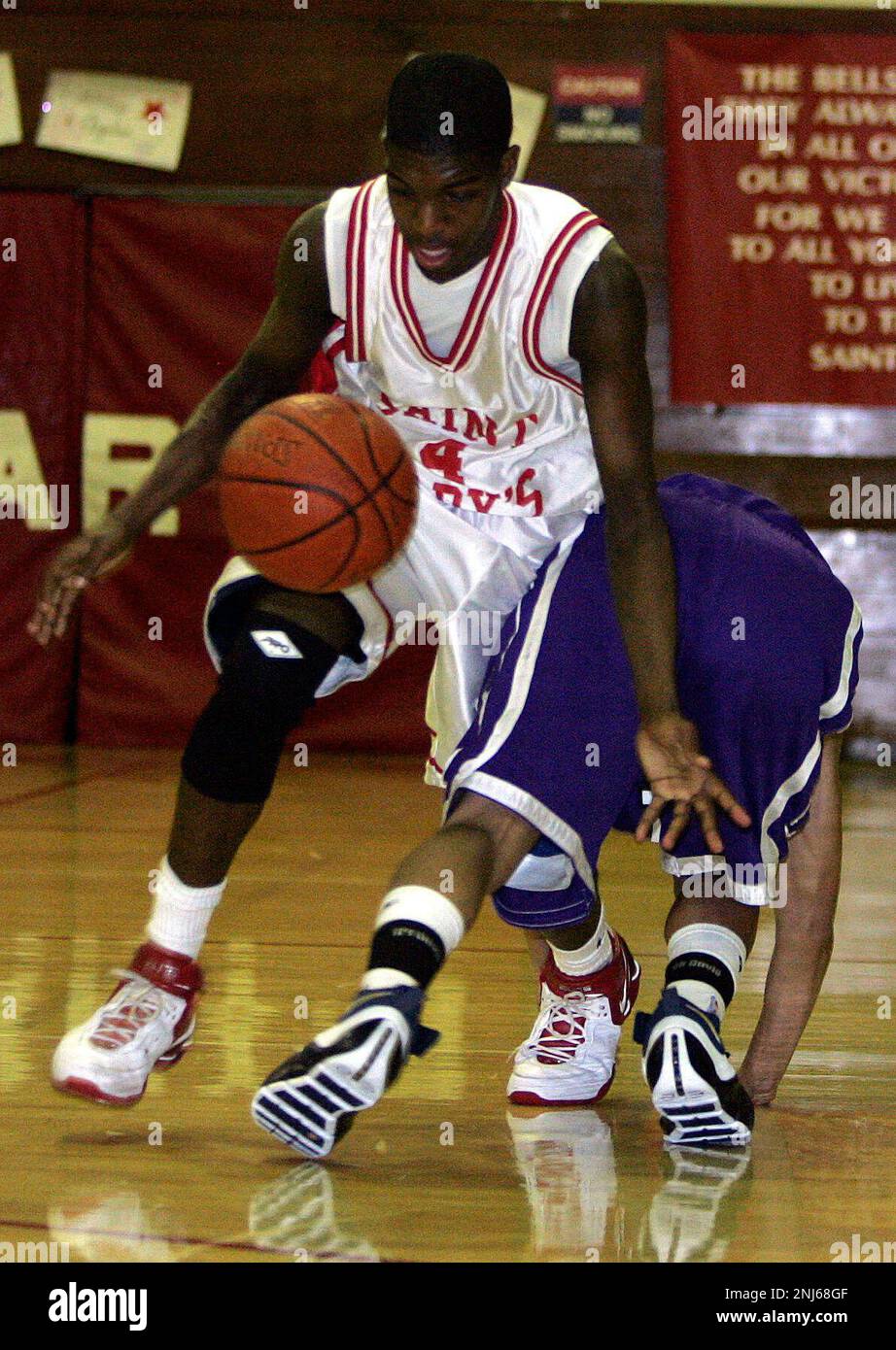 PIEDMONT10 049 LH.JPG High school basketball, boys: Piedmont at St. Marys.  St. Marys Aalim Moor gets control of the ball after Piedmonts Troy Sims  looses it durig the second period. Photographed by