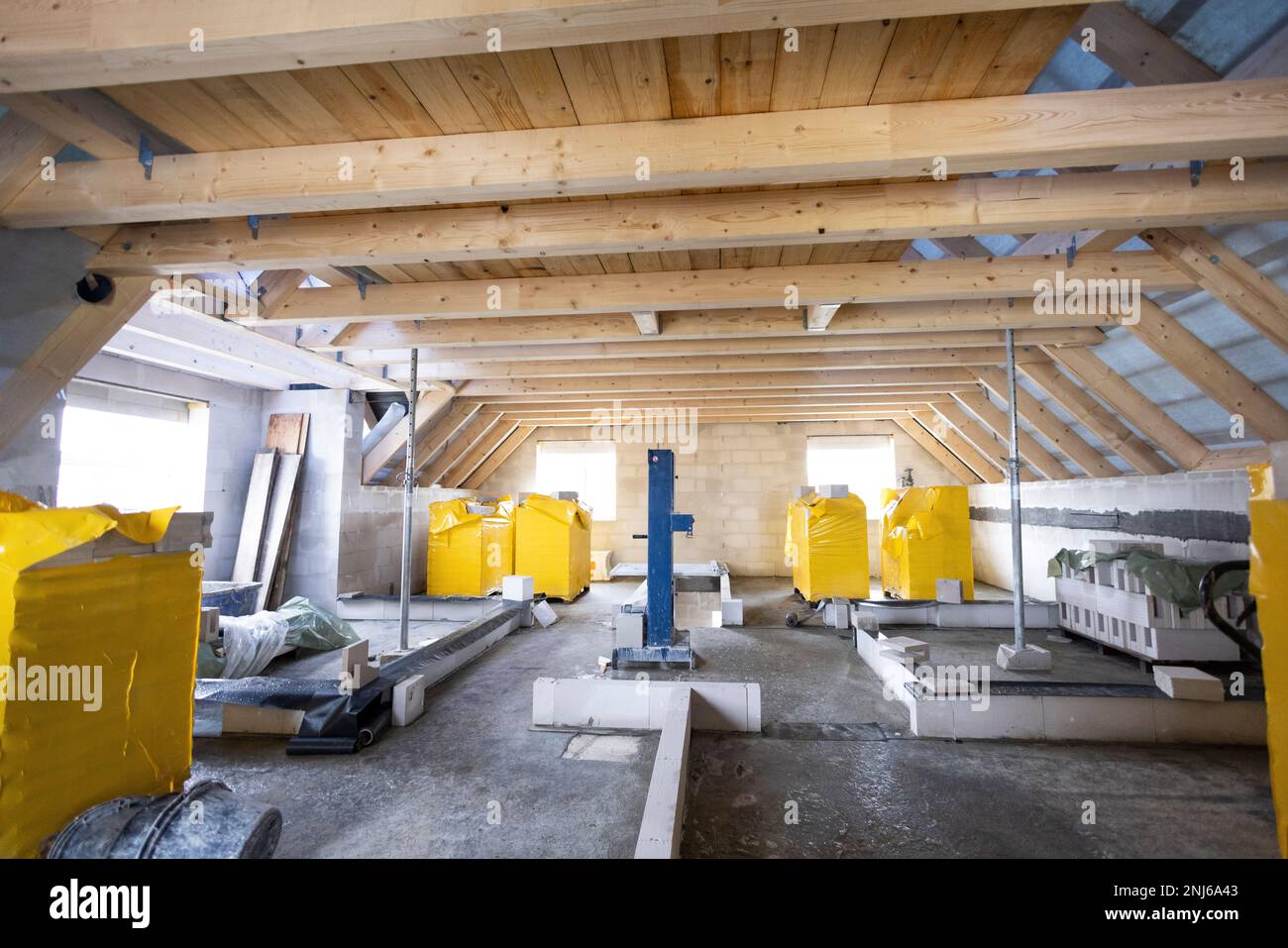 Upper floor with roof beams of a single-family house under construction Stock Photo