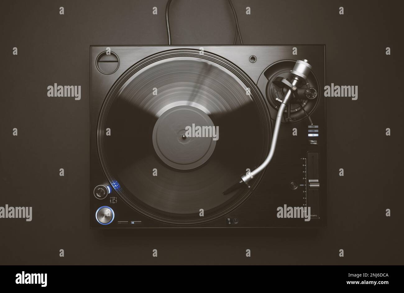 Flat lay image of dj turntable on black background. Overhead photo of professional disc jockey record player Stock Photo