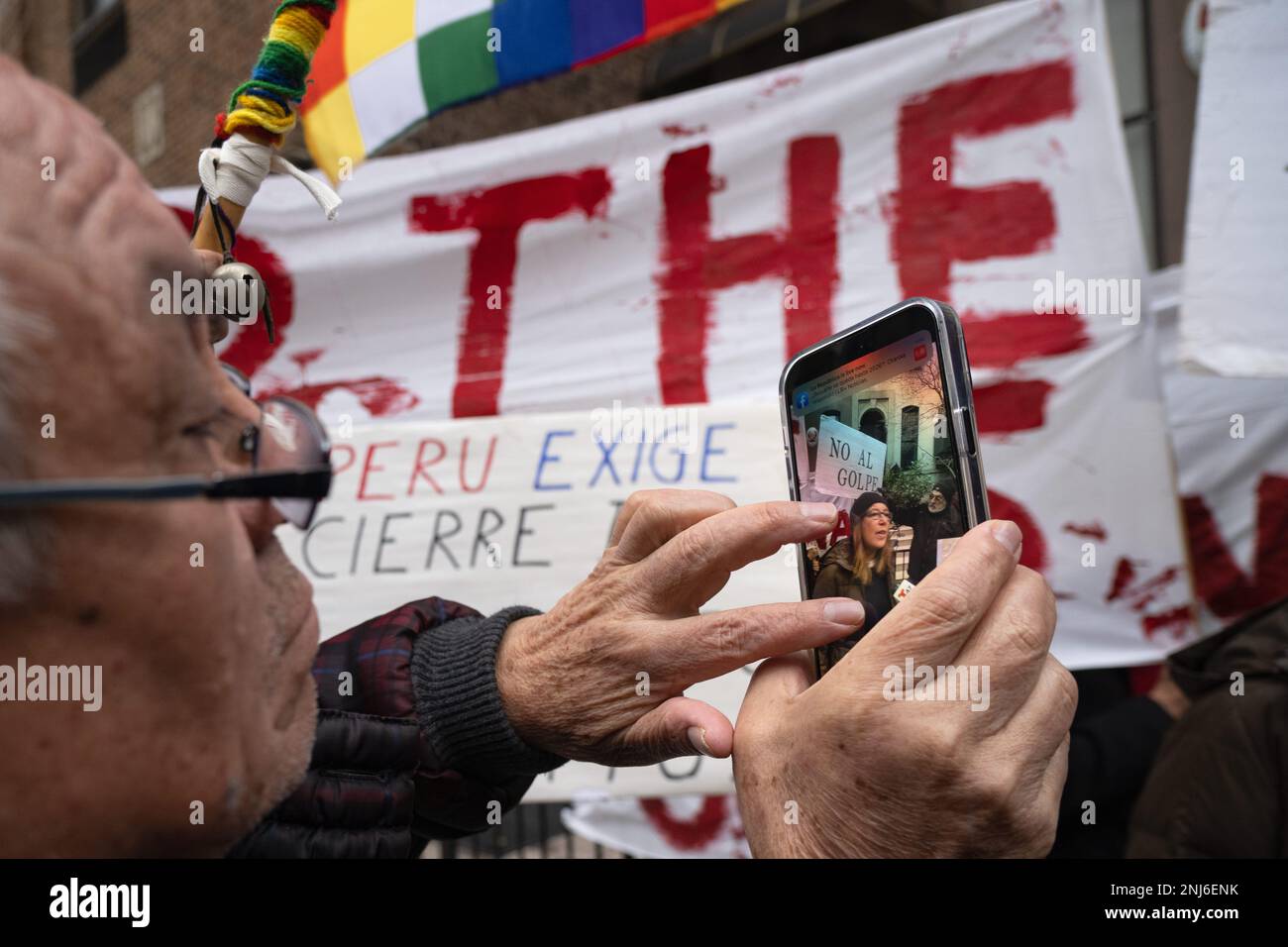New York, New York, USA. 21st Feb, 2023. A protester records activist