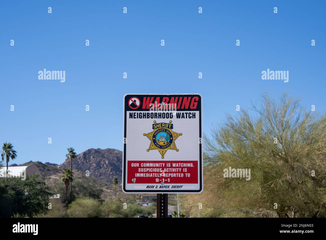 Ajo, AZ - Nov. 28, 2022: Neighborhood watch sign with Pima County Sheriff logo. Ajo crime rates are 24% lower than the national average according to 2 Stock Photo