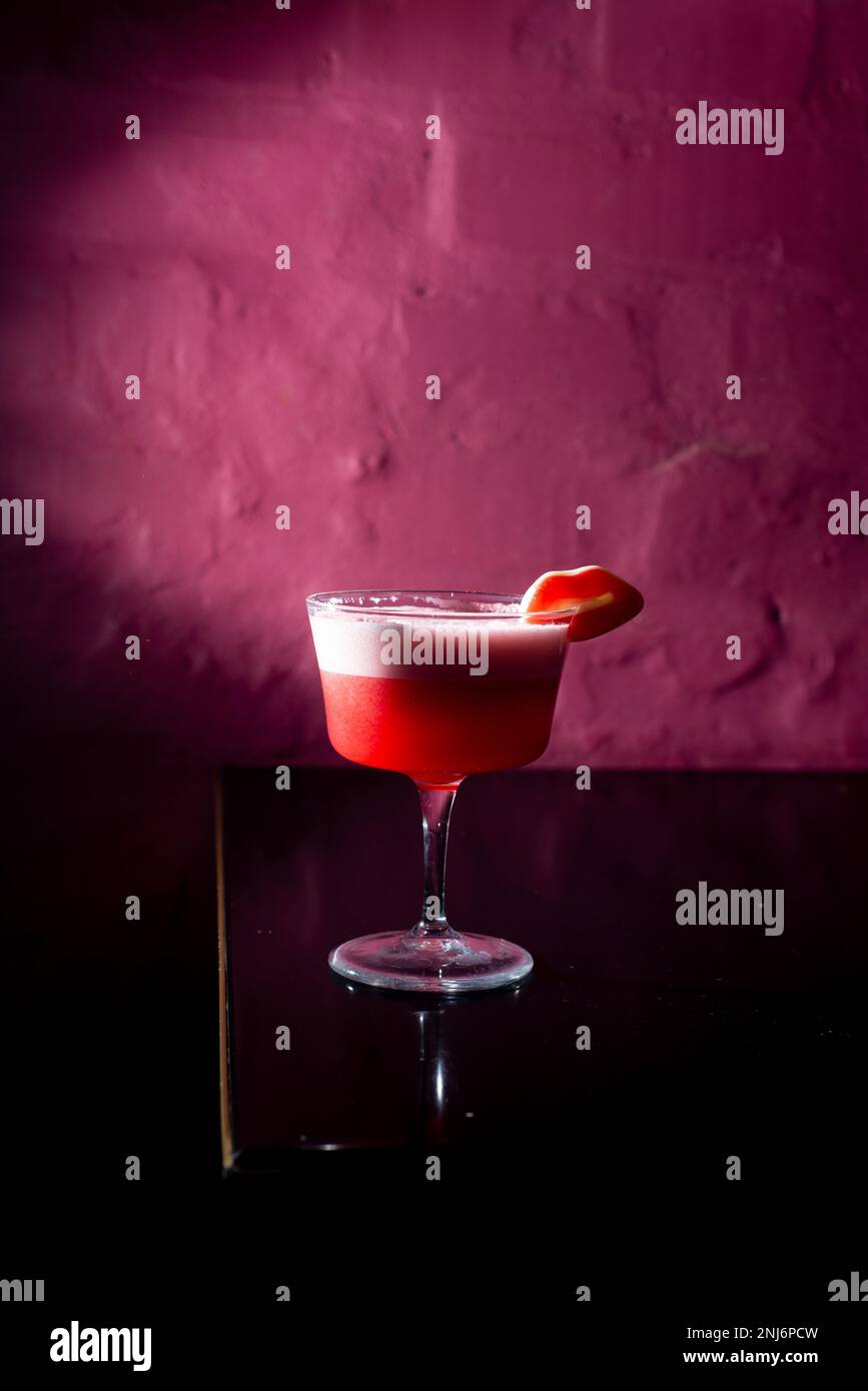 Pink Cocktail on a pink background in the bar. Nightlife concept Stock Photo