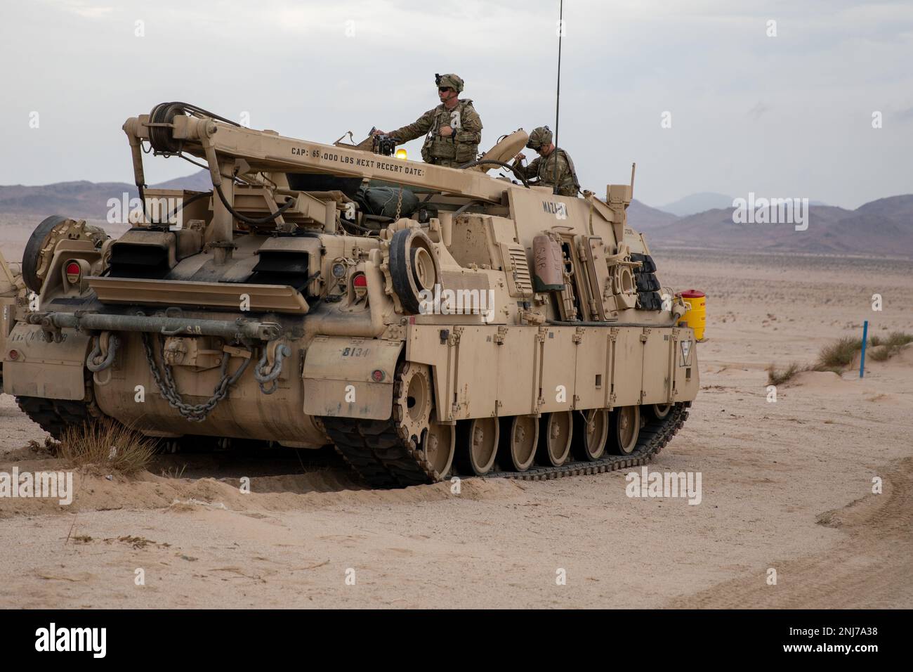 An M113 armored personnel carrier assigned to the 2nd Armored Brigade Combat Team, 1st Infantry Division, departs a temporary base within the “box” at the National Training Center on Fort Irwin, California, August 5, 2022. 2ABCT attended the 22-09 rotation at NTC to evaluate their overall readiness within a combat environment. Stock Photo