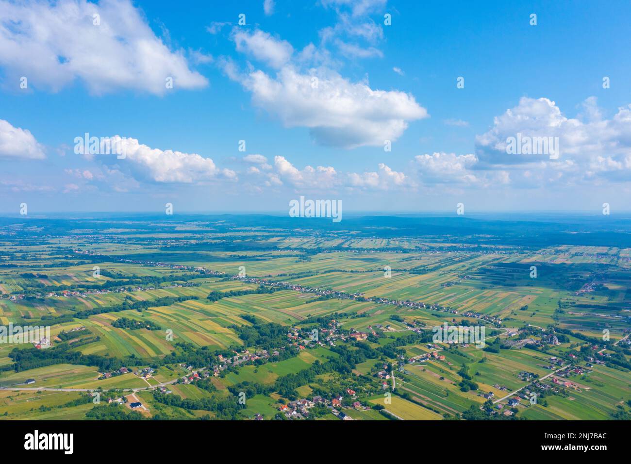 Aerial view on green and yellow parts of fields and countryside Stock Photo