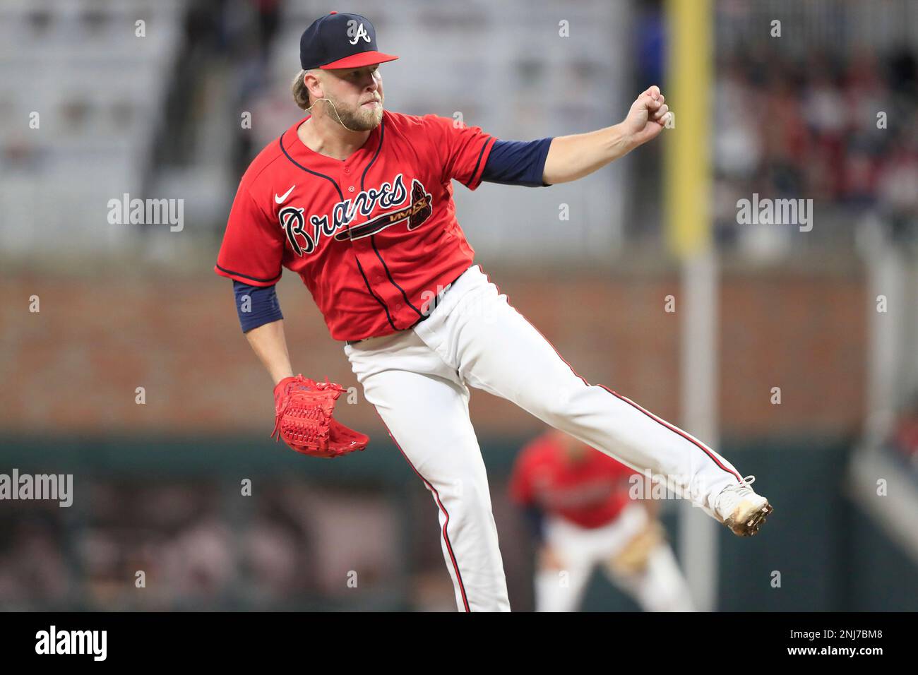 ATLANTA, GA - SEPTEMBER 30: Atlanta Braves relief pitcher A.J. Minter (33)  delivers a pitch during the Friday evening MLB game between the New York  Mets and the Atlanta Braves on September