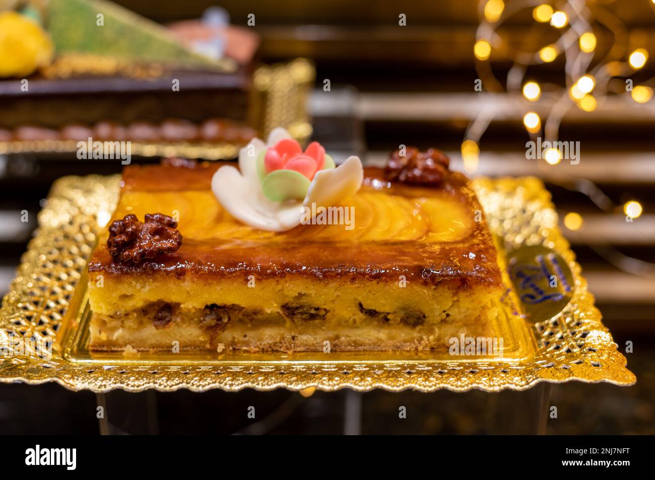 Delicious fresh baked colorful decorated cakes, tarts with cream and ...