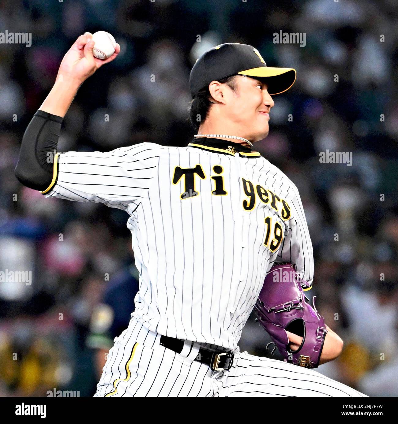 Hanshin Tigers pitcher Shintaro Fujinami throws a ball in a Central League baseball game against the Yomiuri Giants at Koshien Stadium in Hyogo Prefecture on September 18, 2022