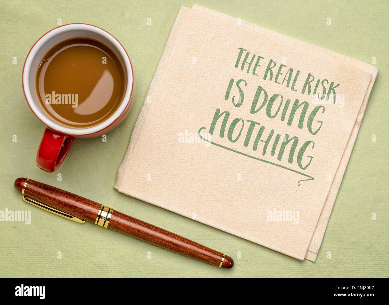 the real risk is doing nothing - inspirational reminder, procrastination and personal development concept Stock Photo