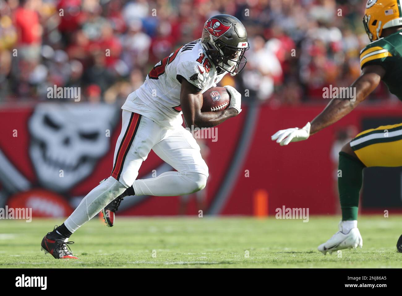 TAMPA, FL - SEPTEMBER 25: Tampa Bay Buccaneers Wide Receiver Breshad  Perriman (16) runs with the ball after making a catch during the regular  season game between the Green Bay Packers and