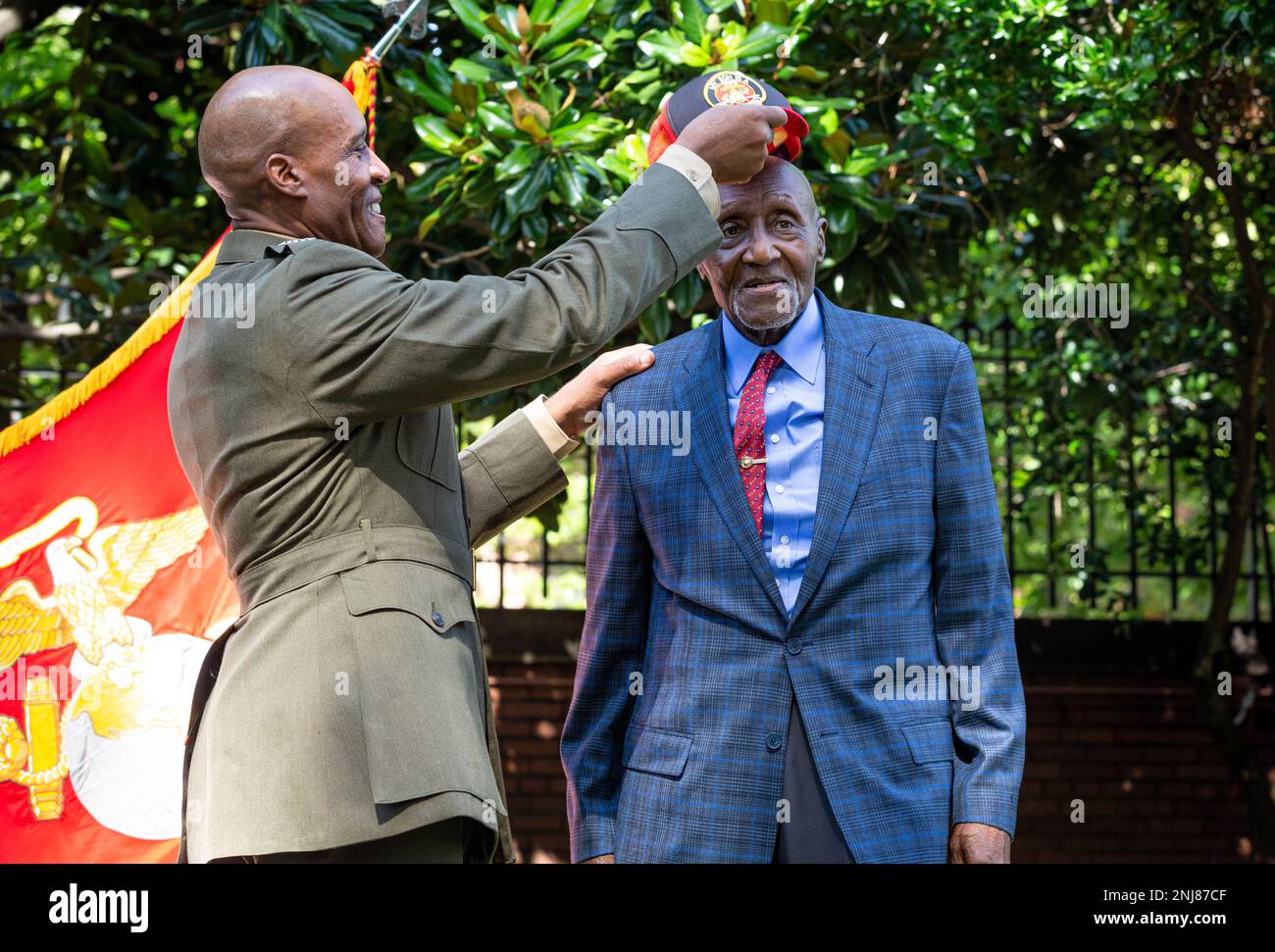 After pinning a hat with the general rank insignia, U.S. Marine Corps ...