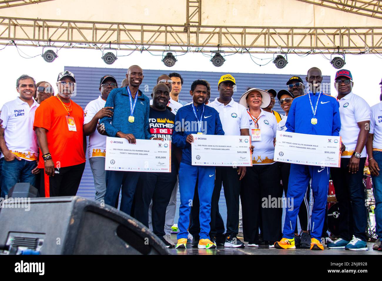 The winners receiving their medals and cheques at the 8th edition of the Access Bank Lagos City Marathon. Lagos, Nigeria. Stock Photo