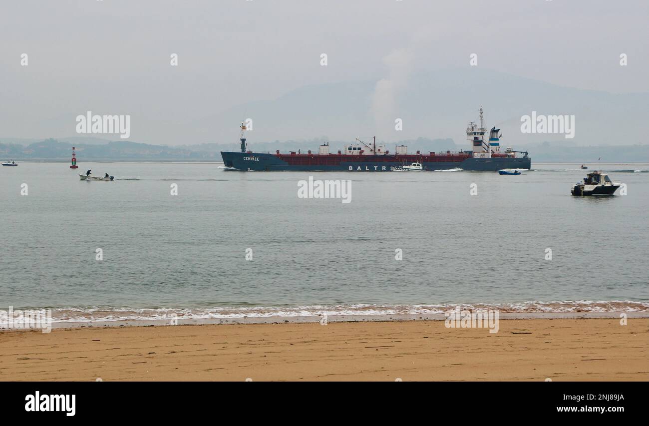 Cemvale Cement Carrier cargo ship leaving the port of Santander on a calm misty winter morning Santander Cantabria Spain Stock Photo