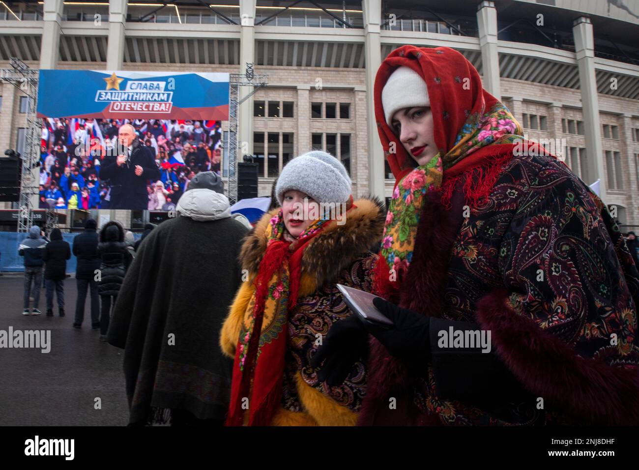 Moscow, Russia. 22nd of February, 2023. People are seen during an open-air concert and rally titled 'Glory to Defenders of Our Fatherland' in Luzhniki stadium, on the eve of Russia's Defender of the Fatherland Day, in Moscow, Russia. Nikolay Vinokurov/Alamy Live News Stock Photo
