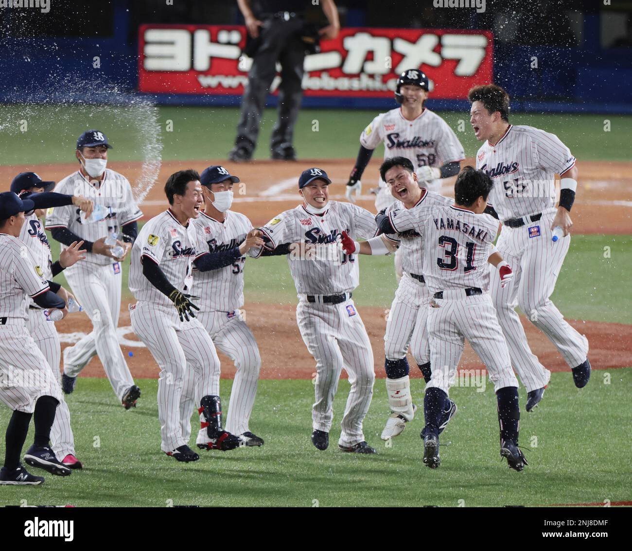 Members of Tokyo Yakult Swallows celebrate after winning the Nippon Professional Baseball (NPB) Central League at Meiji Jingu Stadium in Tokyo on September 25, 2022.( The Yomiuri Shimbun via AP Images Stock