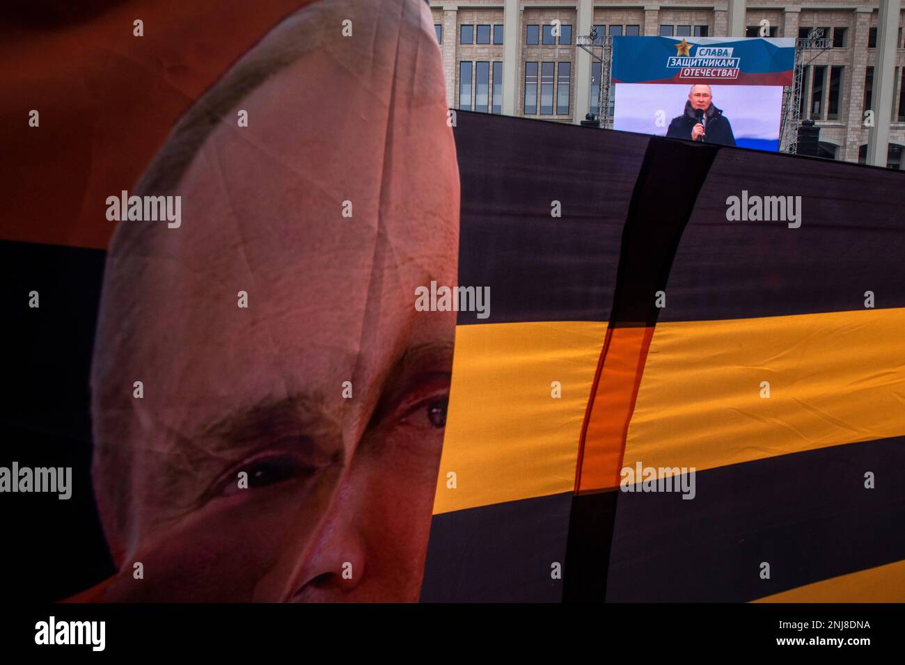 Moscow, Russia. 22nd of February, 2023. People are seen during an open-air concert and rally titled 'Glory to Defenders of Our Fatherland' in Luzhniki stadium, on the eve of Russia's Defender of the Fatherland Day, in Moscow, Russia. Nikolay Vinokurov/Alamy Live News Stock Photo