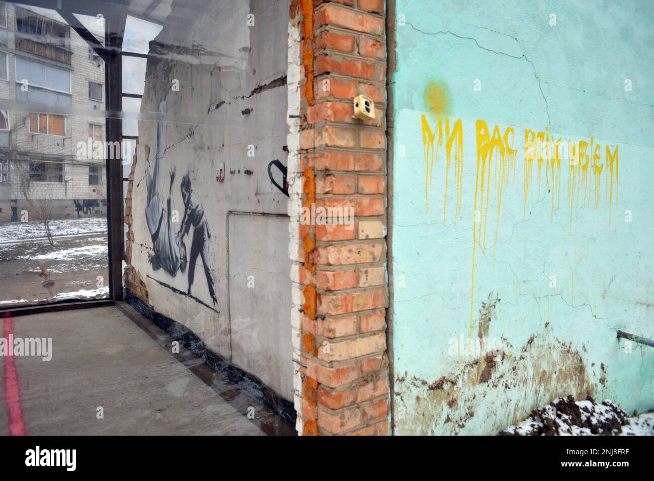 BORODIANKA, UKRAINE - NOVEMBER 22, 2022 - Shockproof walls seal the art piece that features a boy defeating an adult man in judo sparring by British a Stock Photo