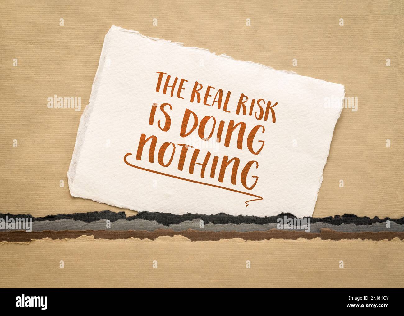 the real risk is doing nothing - inspirational reminder, procrastination and personal development concept Stock Photo