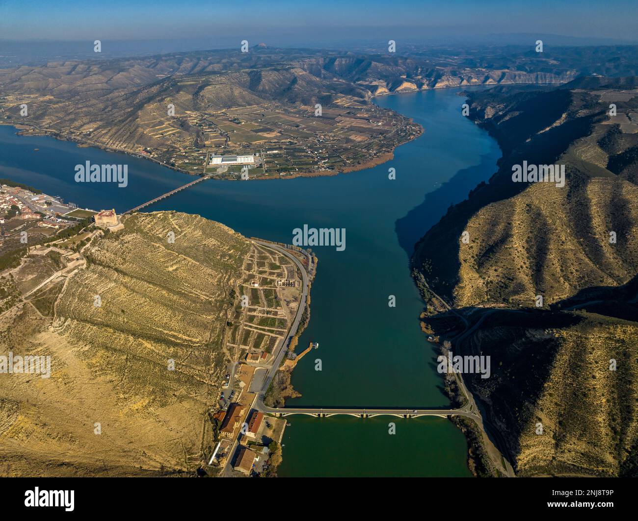 Aerial view of the confluence of the Segre and Ebro rivers and the castle and old town of Mequinenza (Bajo Cinca, Zaragoza, Aragon, Spain) Stock Photo