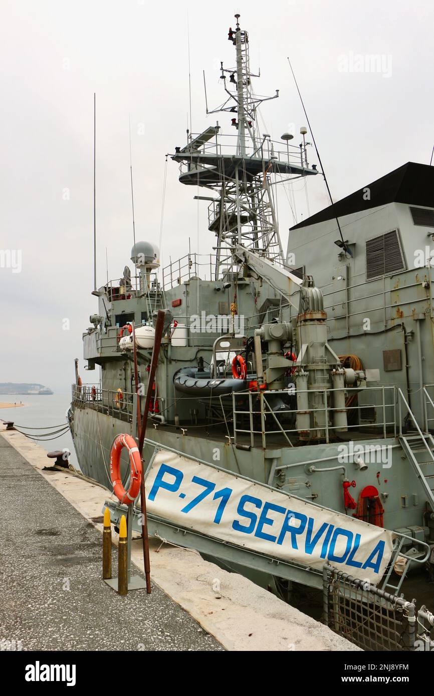 Dummy shells lifebelt and oars at the gangplank Spanish patrol boat Serviola P-71 moored in the Gamazo port area of Santander Bay Cantabria Spain Stock Photo