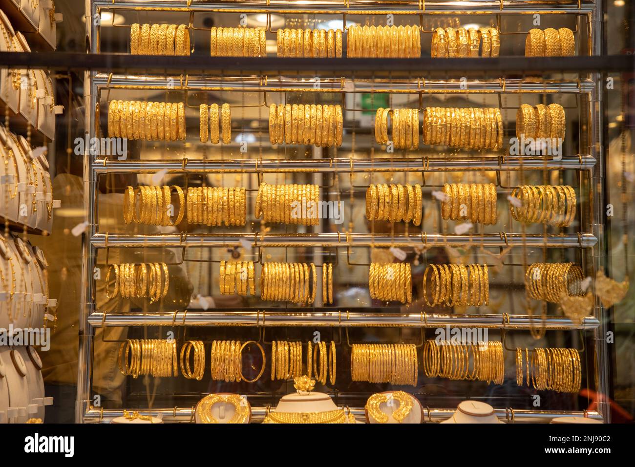 Gold jewellery displayed in shop hires stock photography and images