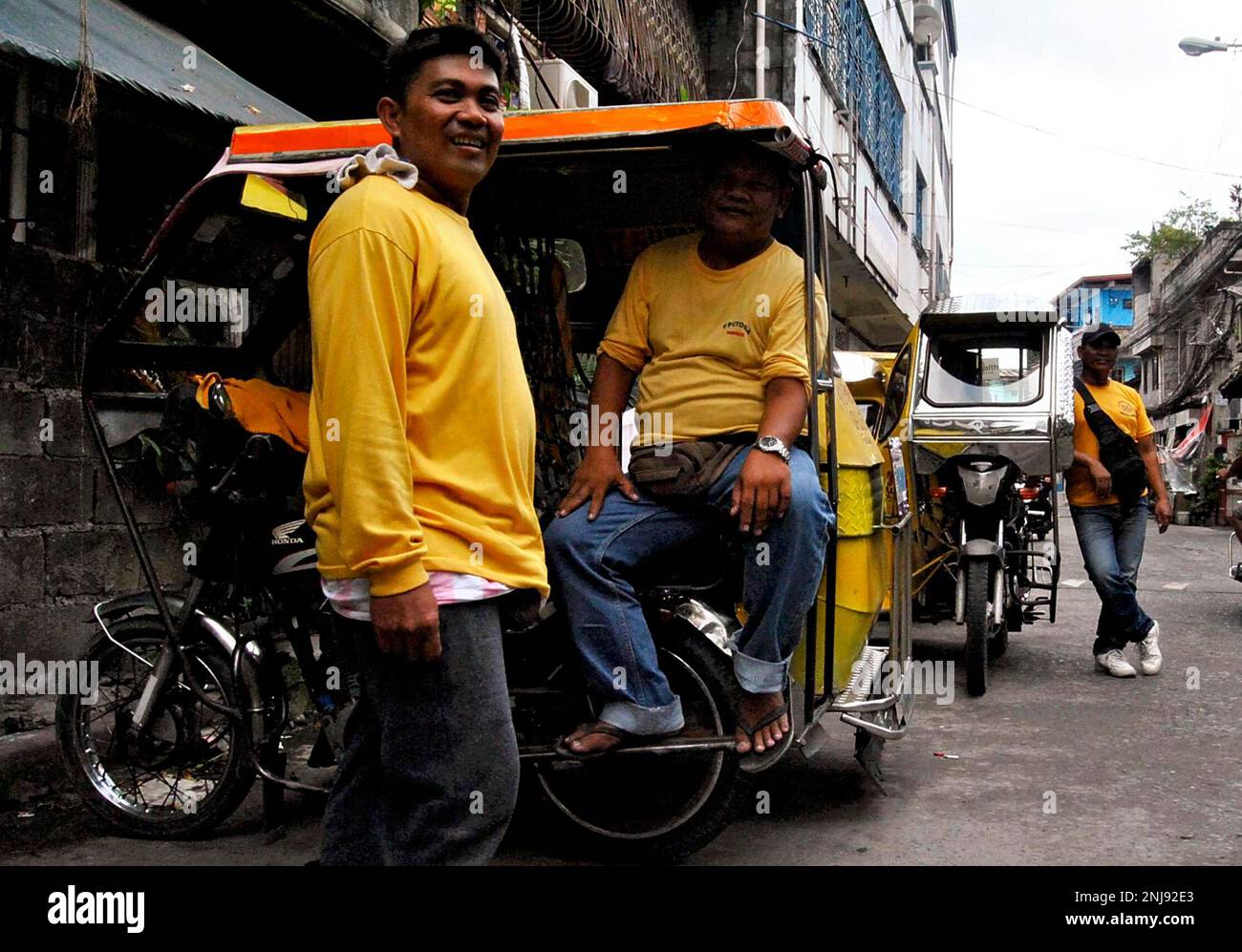 Drivers of tricycles, auto rickshaw, are pictured in Manila metropolitan region on September 19
