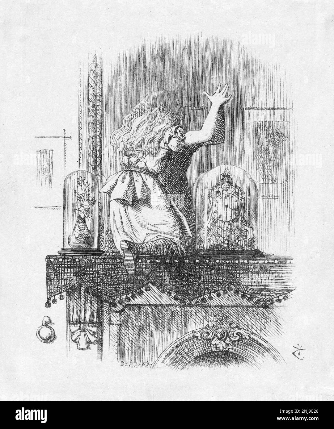 Alice at the Looking Glass, an illustration by Sir John Tenniel for Lewis Carroll's 'Through the Looking-Glass, and What Alice Found There', wood engraving, 1872 Stock Photo